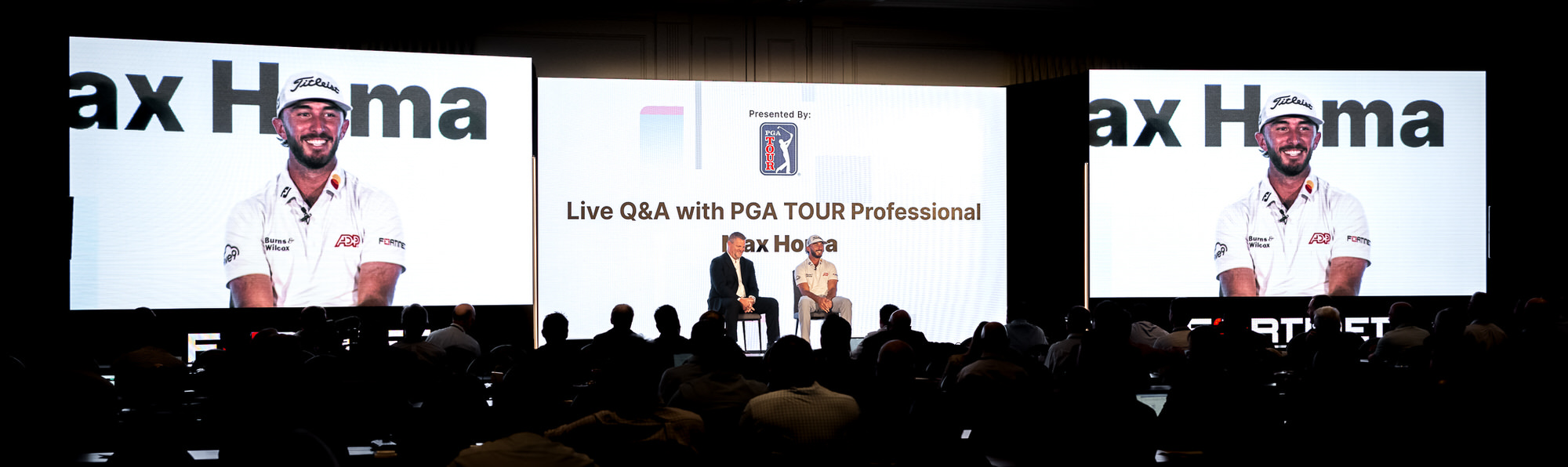 Live Q&A on the main stage, with the guest shown on three large screens